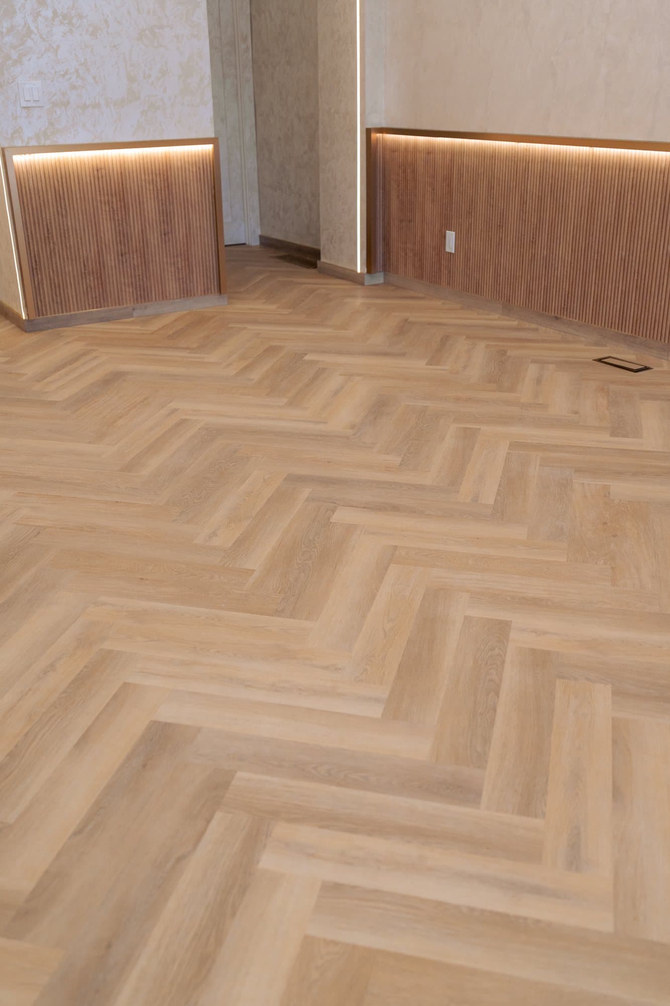 The cove light floating the oak wainscot off the floor